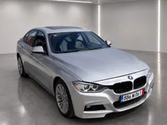 BMW 328i xDrive — Front three-quarter view