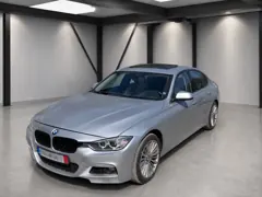 BMW 328i xDrive — Front side view