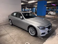 BMW 328i xDrive — Front three-quarter view
