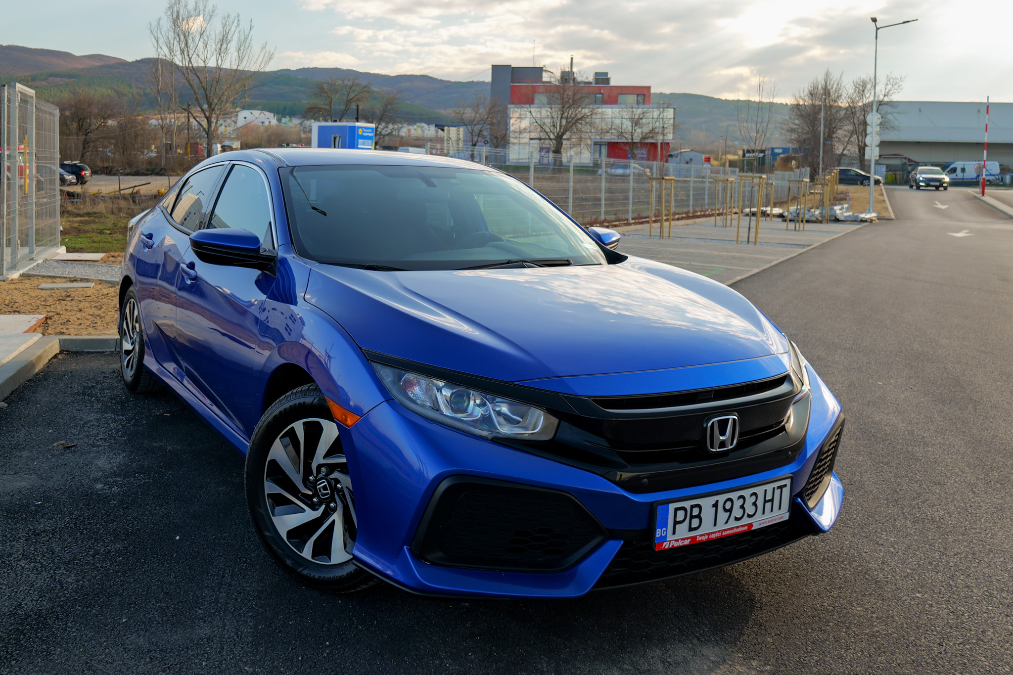 Honda Civic 1.5 VTEC Turbo in Aegean Blue front three-quarter view